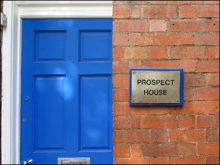A blue door with a sign on it

Description automatically generated with medium confidence