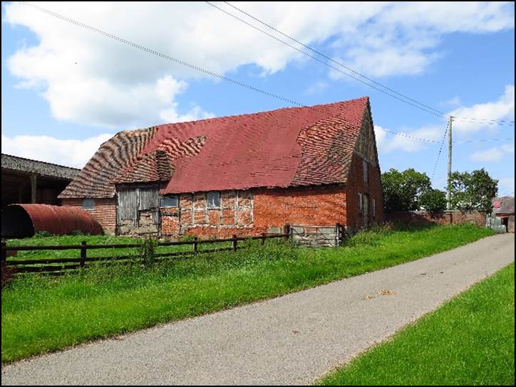 A picture containing grass, sky, outdoor, old

Description automatically generated