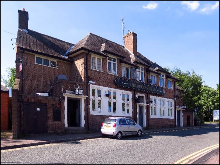 A brick building with a car parked in front

Description automatically generated with low confidence