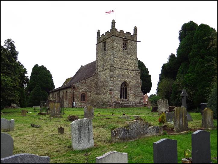 A cemetery with a church in the background

Description automatically generated with low confidence