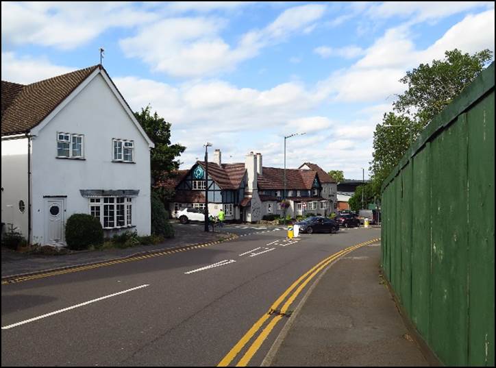 A road with houses along it

Description automatically generated with low confidence