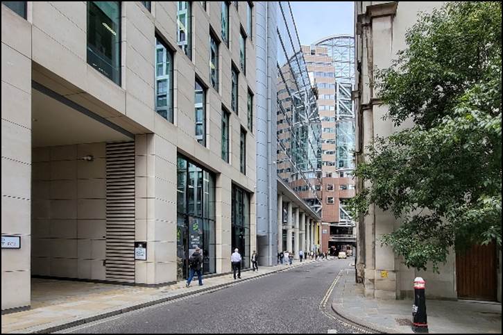 A street with buildings and trees

Description automatically generated