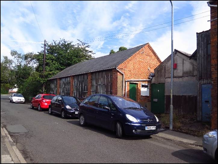 Cars parked on the side of a road

Description automatically generated with low confidence