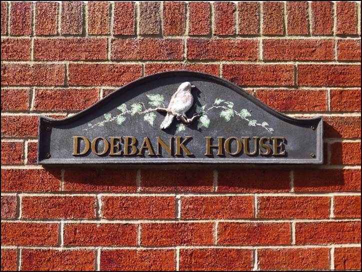 A sign on a brick wall

Description automatically generated