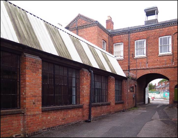 A picture containing building, outdoor, brick, street

Description automatically generated