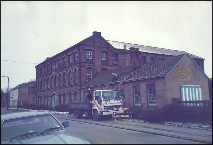 A fire truck parked in front of a brick building

Description automatically generated with low confidence