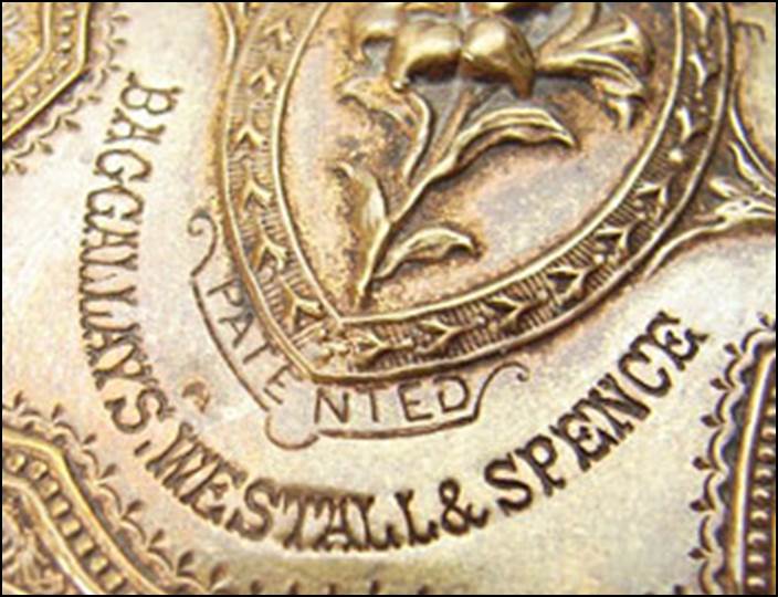 Close-up of a coin with engraved text

Description automatically generated