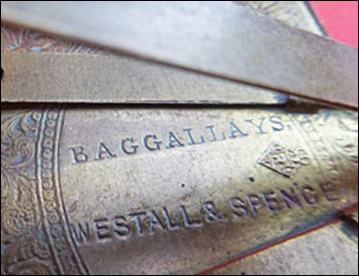 Close-up of a metal object with writing on it

Description automatically generated