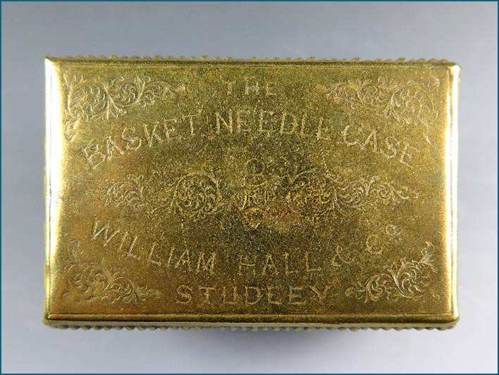 A gold rectangular object with text

Description automatically generated