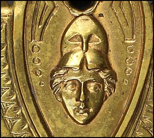 A close-up of a coin

Description automatically generated with medium confidence