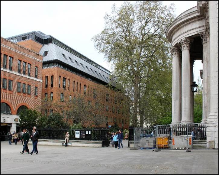 A group of people walking in front of a building

Description automatically generated with low confidence