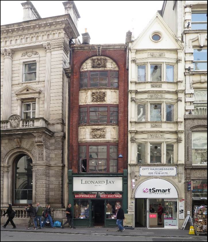 A group of people walking in front of a building

Description automatically generated