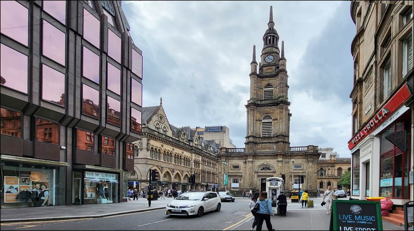 A clock tower in a city

Description automatically generated