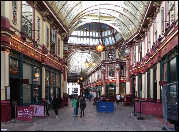People walking in a shopping mall with Leadenhall Market in the background

Description automatically generated