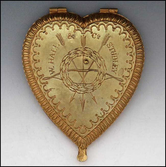 A gold heart shaped object with a logo

Description automatically generated