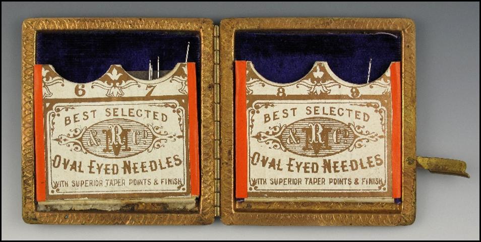 An open box with needle in it

Description automatically generated