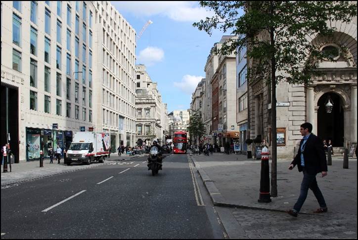 A person walking down a sidewalk

Description automatically generated with low confidence