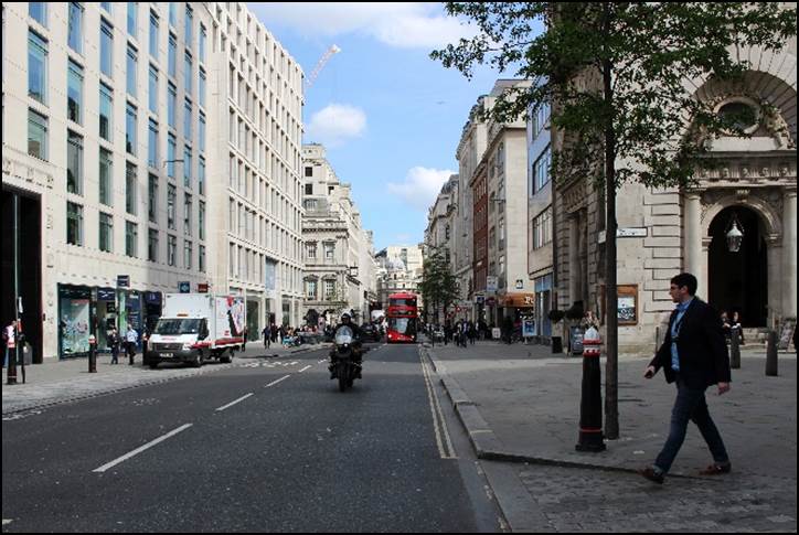 A person walking down a sidewalk

Description automatically generated with low confidence