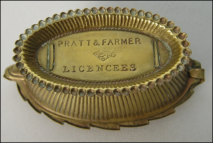 A close-up of a gold oval object

Description automatically generated