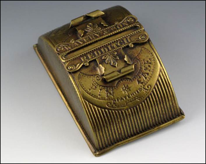 A close-up of a brass cash register

Description automatically generated