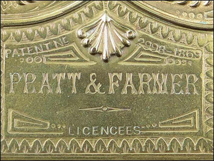 A close-up of a metal plaque

Description automatically generated