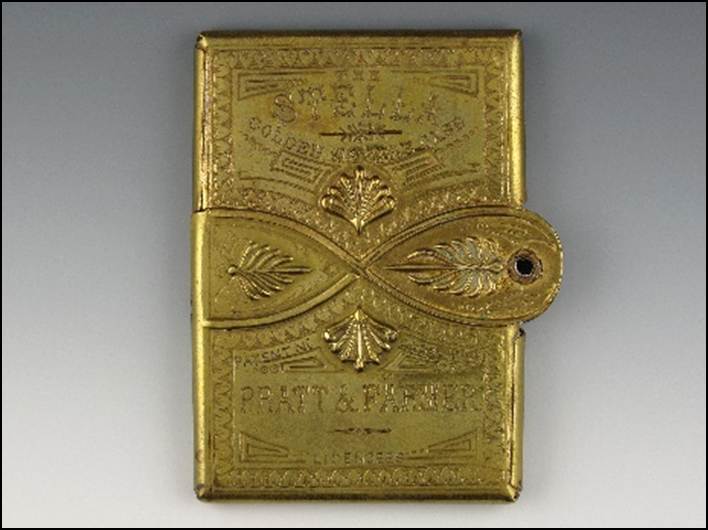 A gold rectangular object with a handle

Description automatically generated