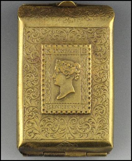 A gold rectangular object with a picture on it

Description automatically generated