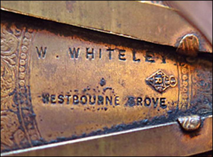 Close-up of a metal plaque

Description automatically generated