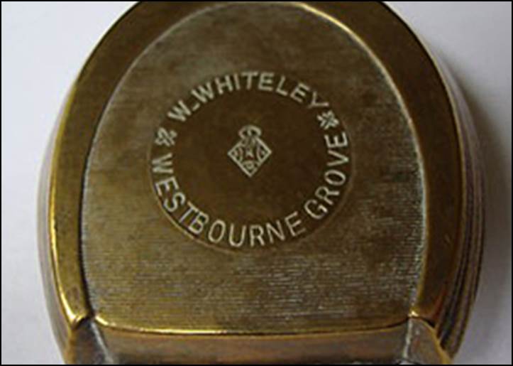 A close-up of a brass container

Description automatically generated