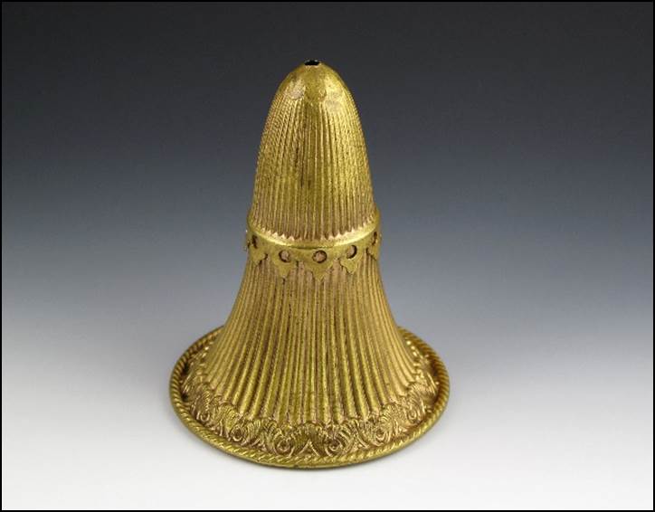 A gold bell with a cone

Description automatically generated with medium confidence