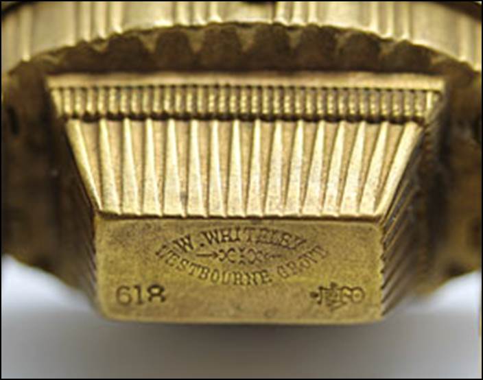 A close-up of a gold object

Description automatically generated