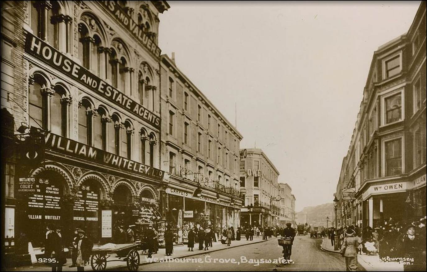 A black and white photo of a street

Description automatically generated